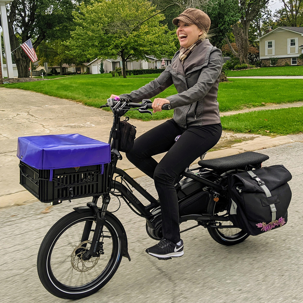 Tatiana riding past houses sq 1000p