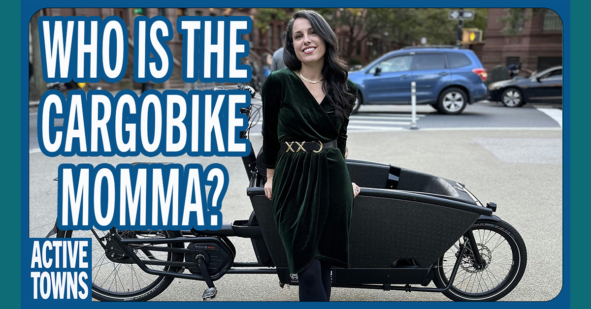 Woman standing in front of a front-loading cargo bike