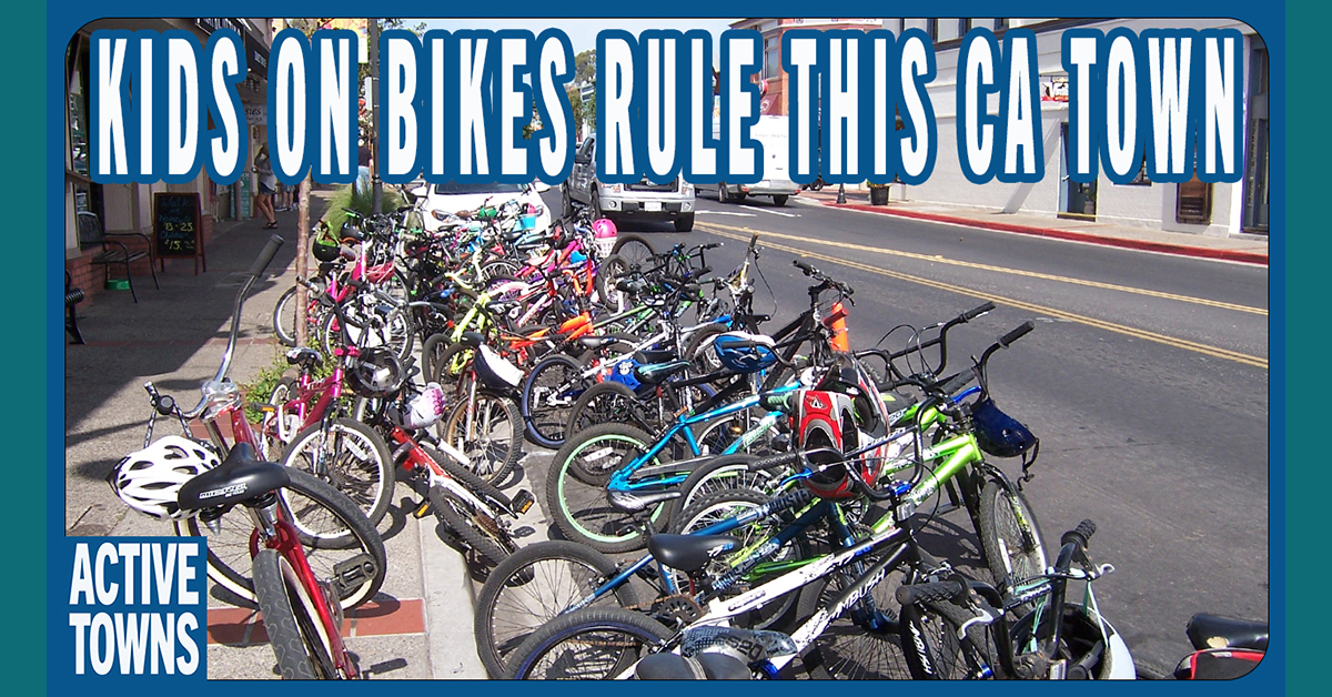 About 40 to 60 bikes parked in front of an ice cream shop