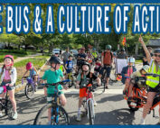 A large group of bike bus participants posing for a group photo