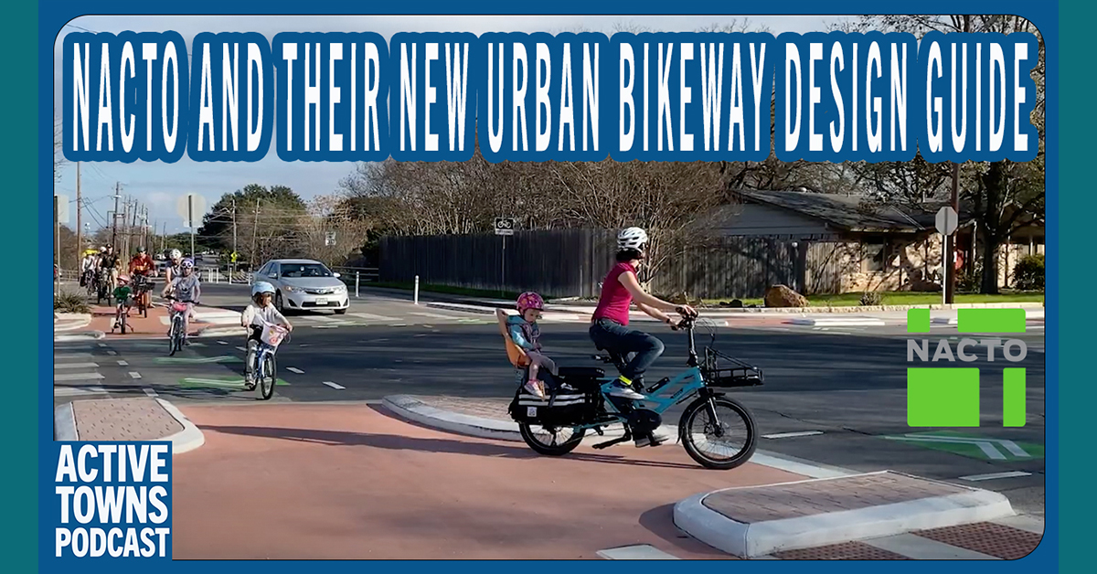Families riding bikes in a protected bike lane and protected intersection