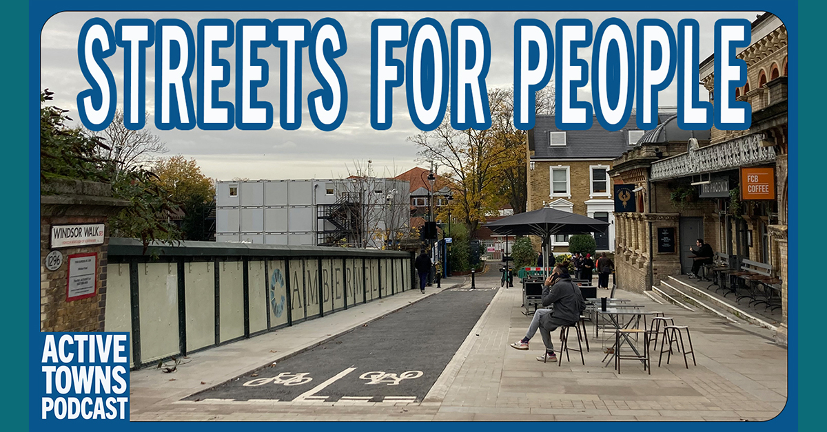 Transformed street with a two way cycle track and expanded pedestrian area and cafe seating