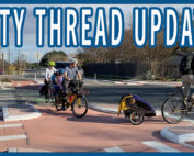 A family cycling through a Dutch-style protected intersection