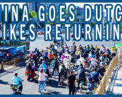 Overhead shot of a very wide bike lane with a lot people on bikes and scooters in China