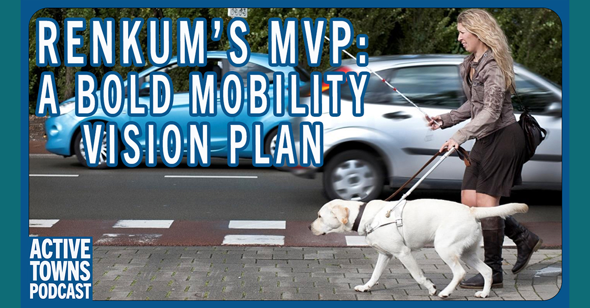 A visually impaired woman walking with a cane and a seeing eye guide dog