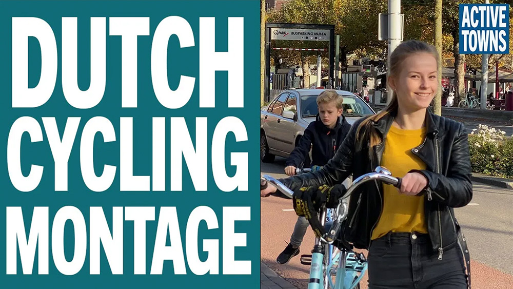A young Dutch woman pushing a bike in Amsterdam
