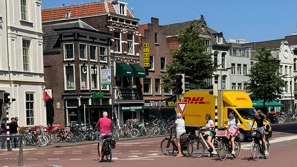 Several people on bikes on Utrecht's busiest cycle and transit street
