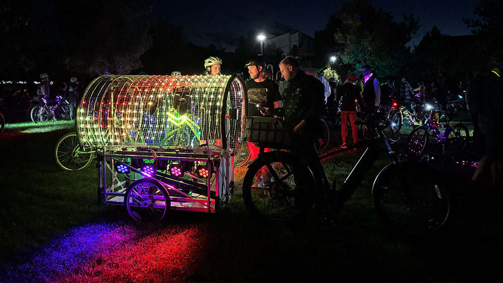 A brightly lit bike float from the Thursday night cruiser ride